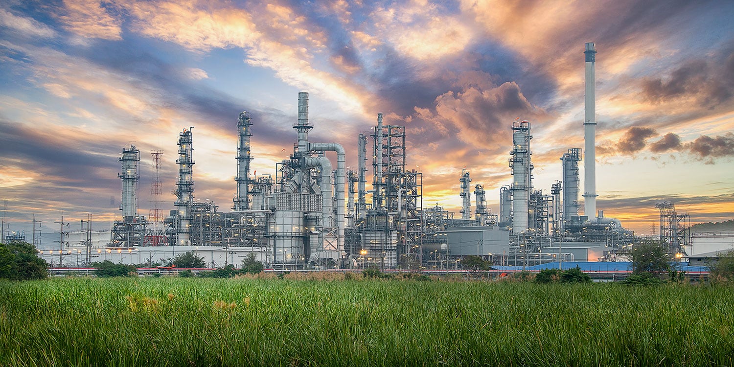 a factory with green grass