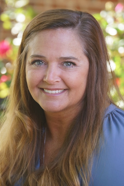 a woman smiling for the camera