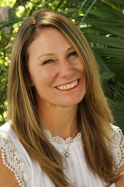 a woman smiling for the camera