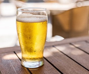 a glass of beer on a table