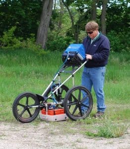 a man standing next to a bicycle