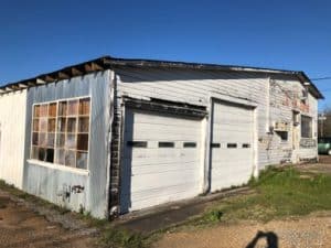 a horse standing in front of a house