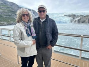 a person standing next to a body of water