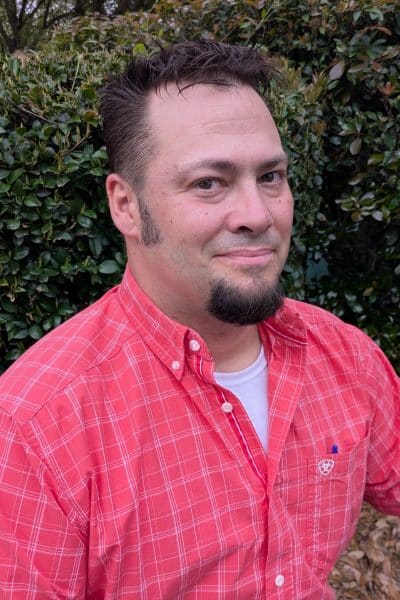 a man wearing a pink shirt